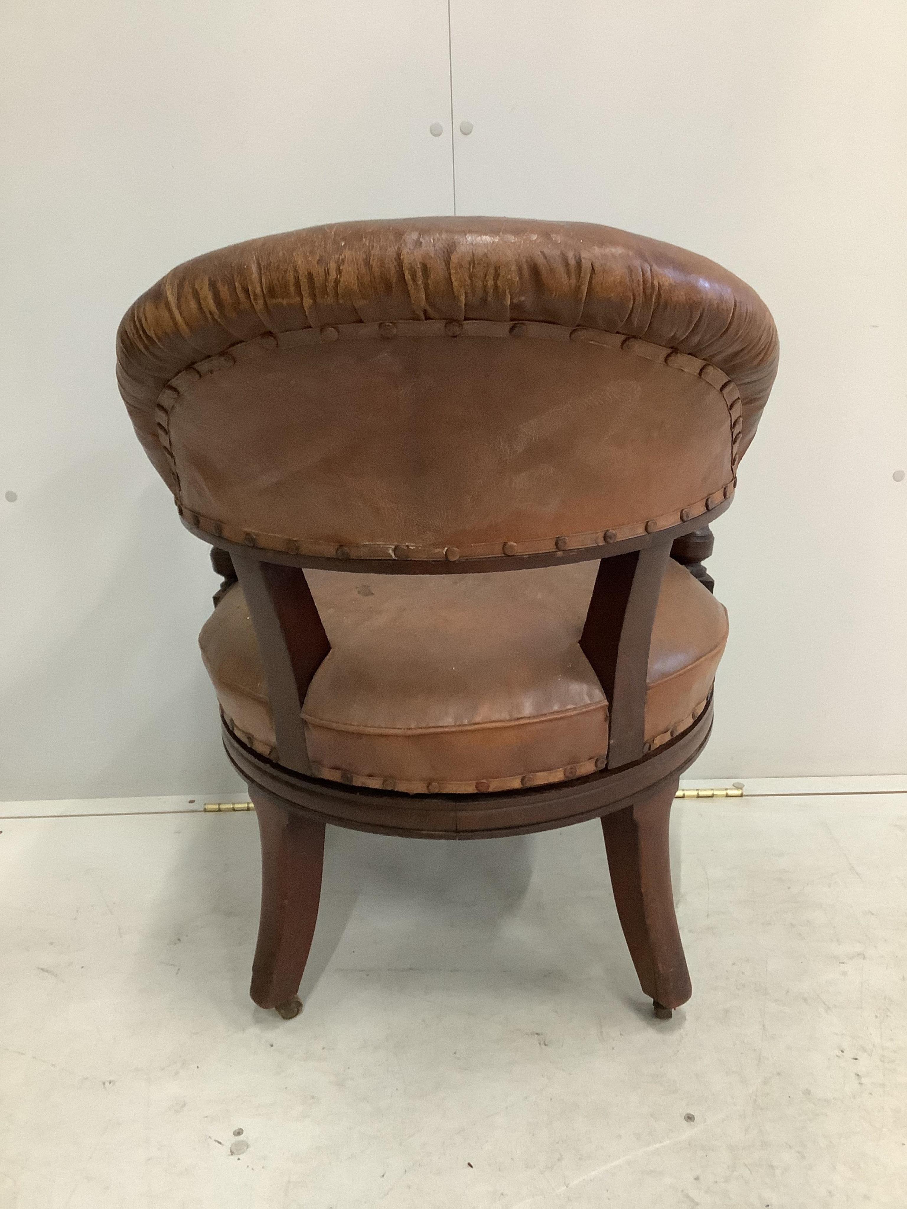 A 19th century Holland & Son leather button back office chair (missing one castor), width 65cm, depth 56cm, height 80cm. Condition - poor